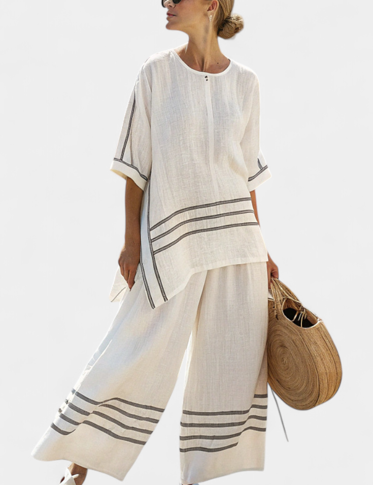 Vittorina – top asymétrique à rayures sophistiqué et pantalons audacieux